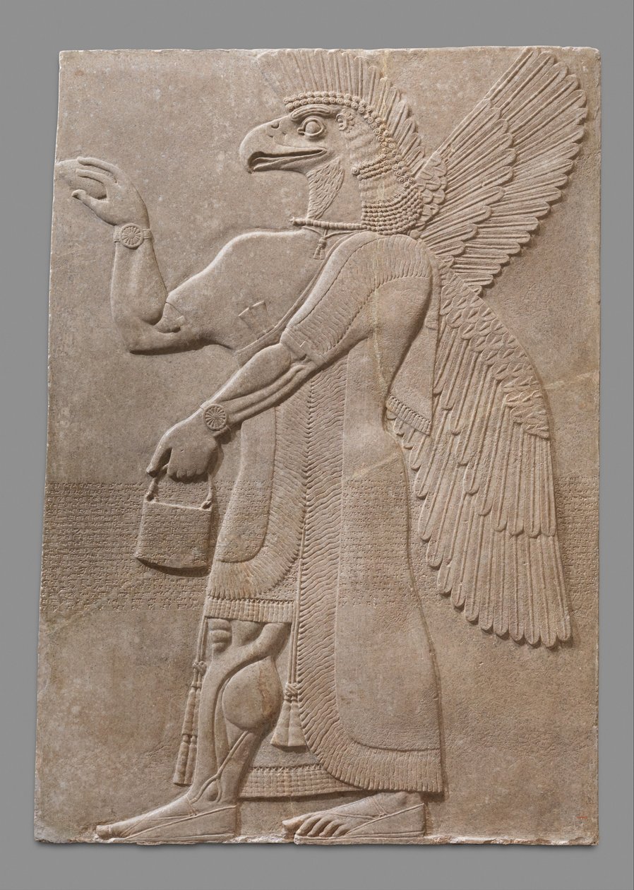 Relief panel of winged eagle-headed supernatural figure by Neo Assyrian