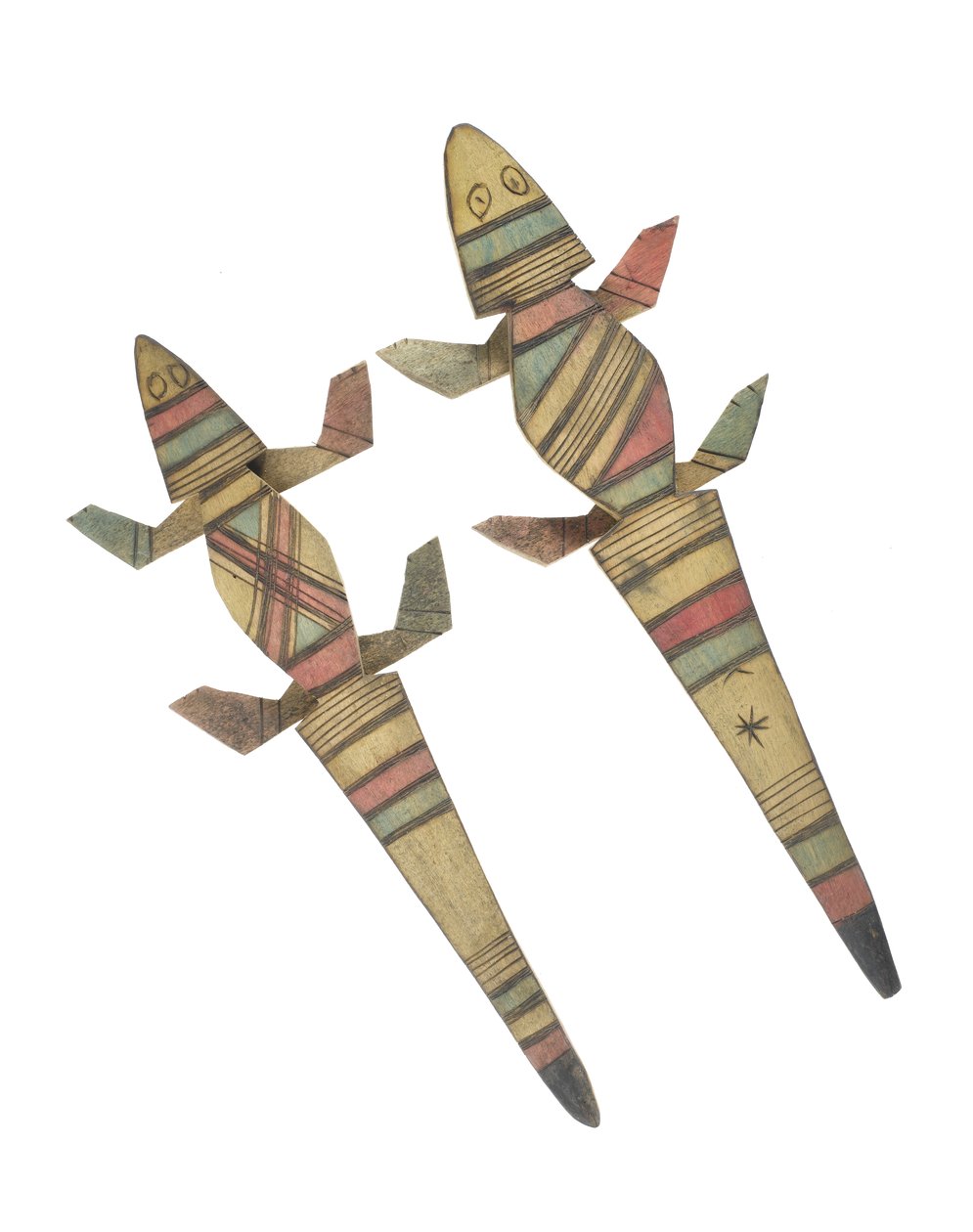 Carved wooden crocodile figures decorated with red, green and black painted geometric patterns, Hausa People, Kano, Northern Nigeria by Nigerian Nigerian