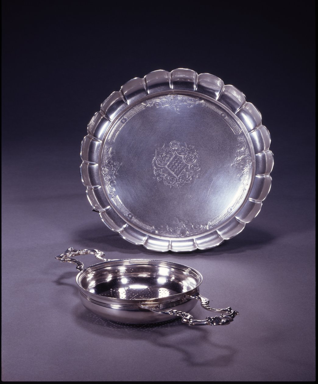 George II orange strainer, circular bowl with two openwork shell and scroll handles by Paul de Lamerie