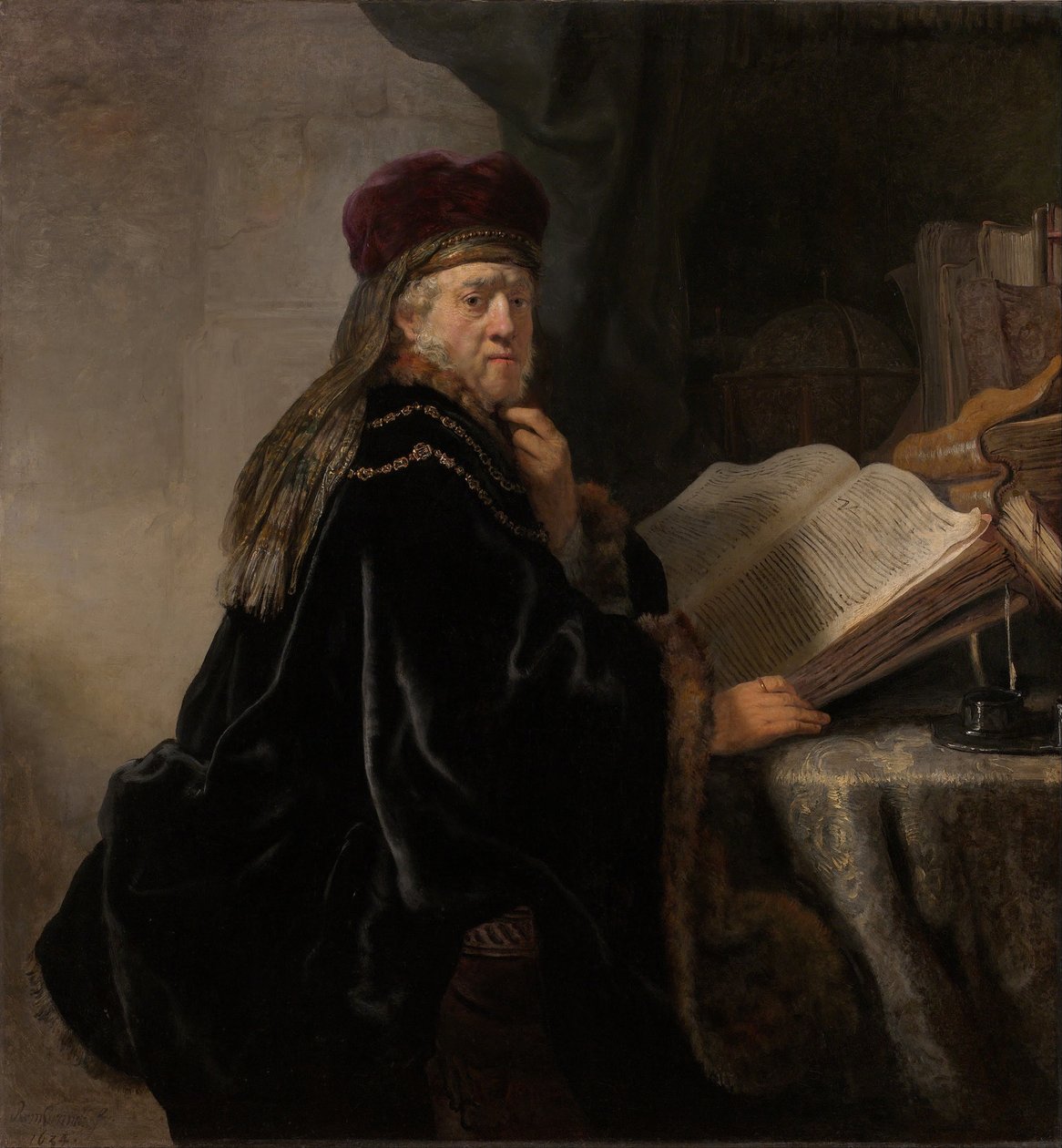 A Scholar Seated at a Desk by Rembrandt van Rijn