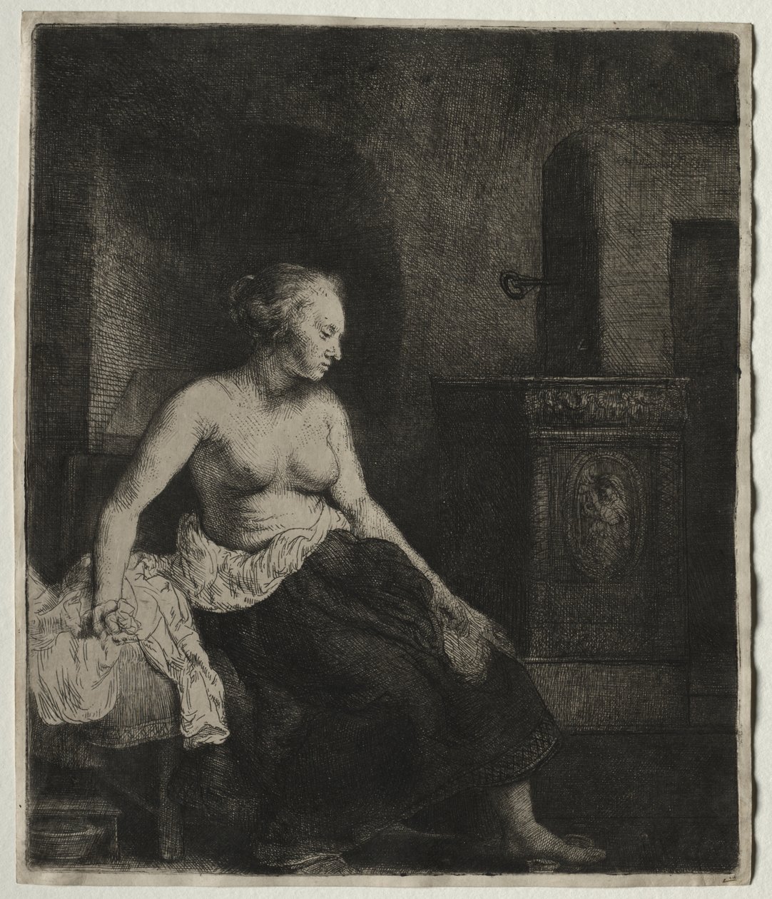 Woman Sitting Half Dressed Beside a Stove by Rembrandt van Rijn