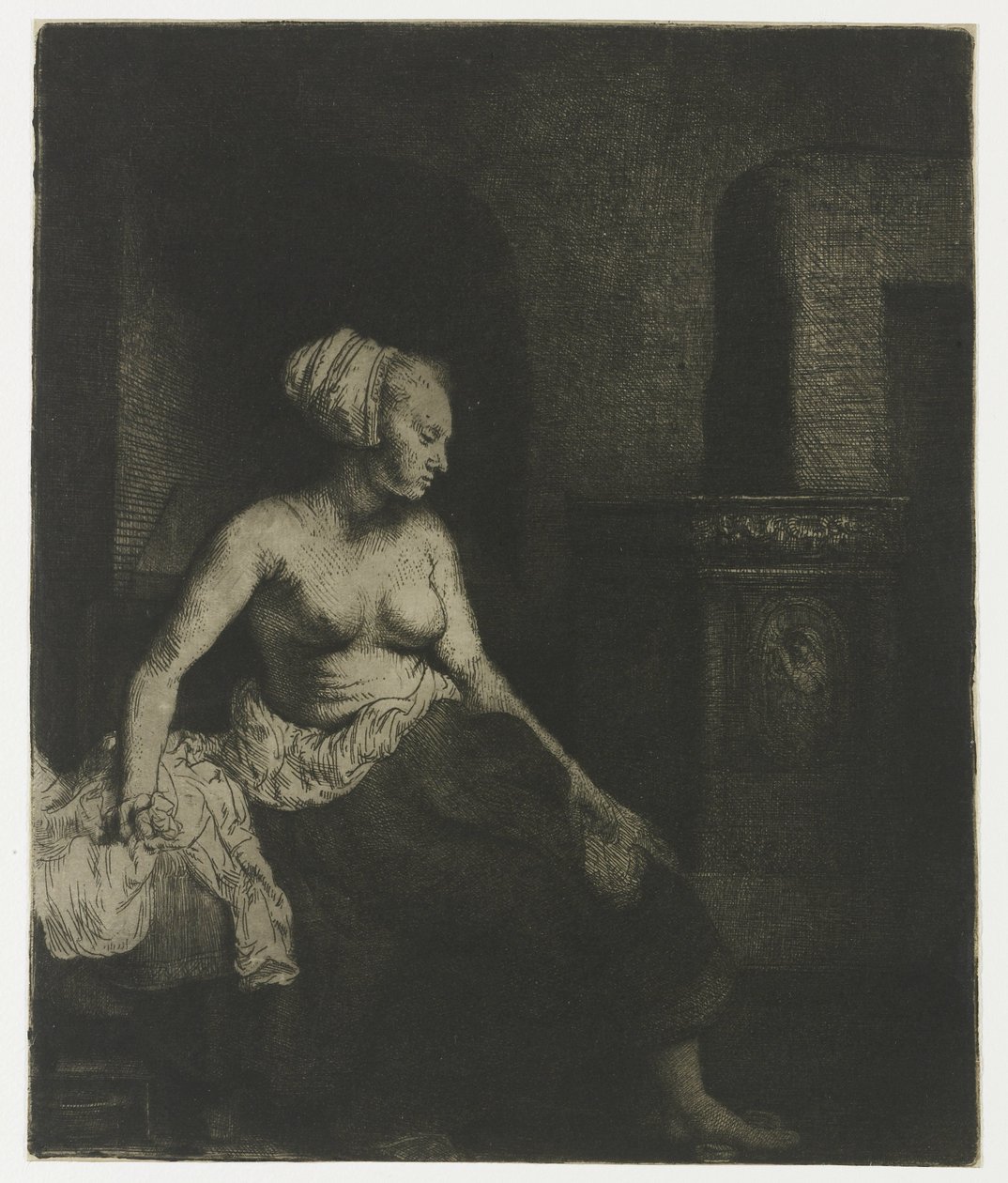 Woman Sitting Half Dressed beside a Stove by Rembrandt van Rijn