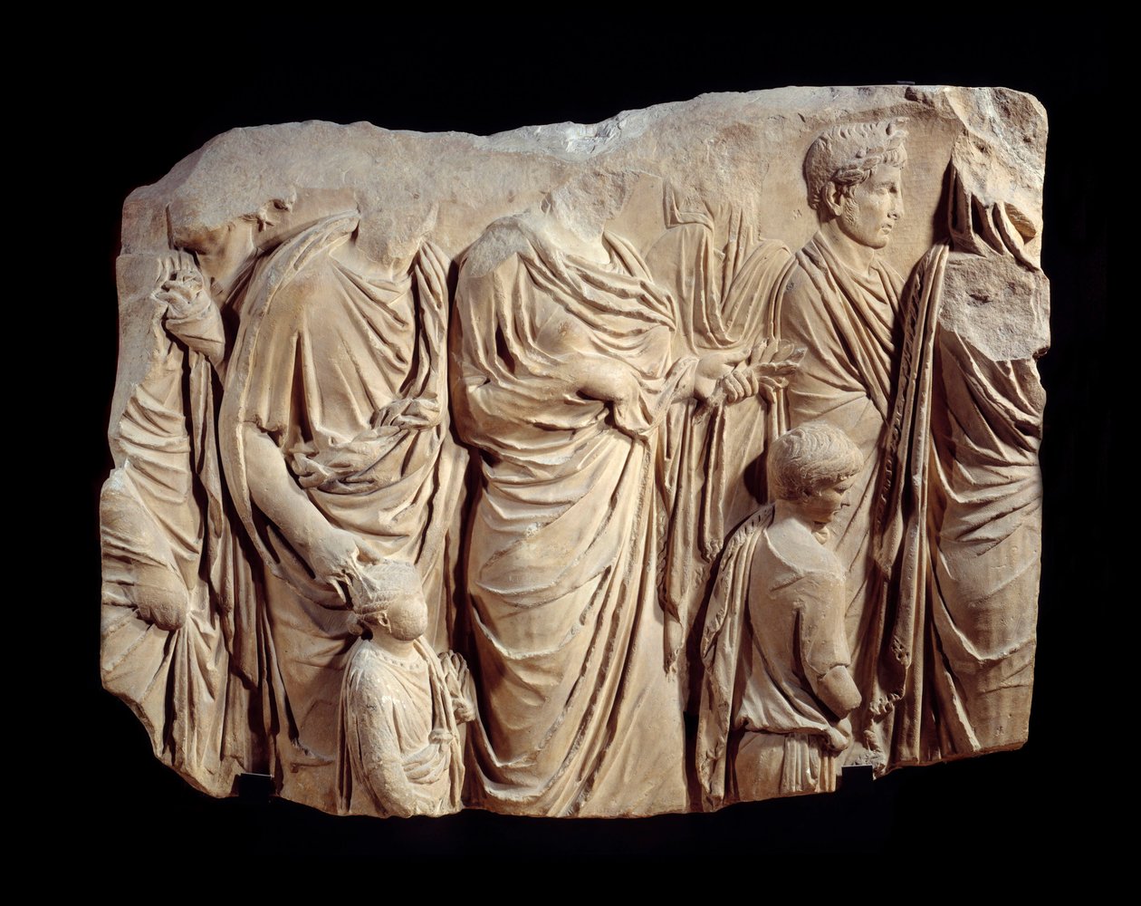 Roman art: fragment of architectural relief in marble from the procession of the Ara Pacis Augustae (altar of peace): procession, during a sacrifice, of figures in toga and children. Around 13-9 BC by Roman
