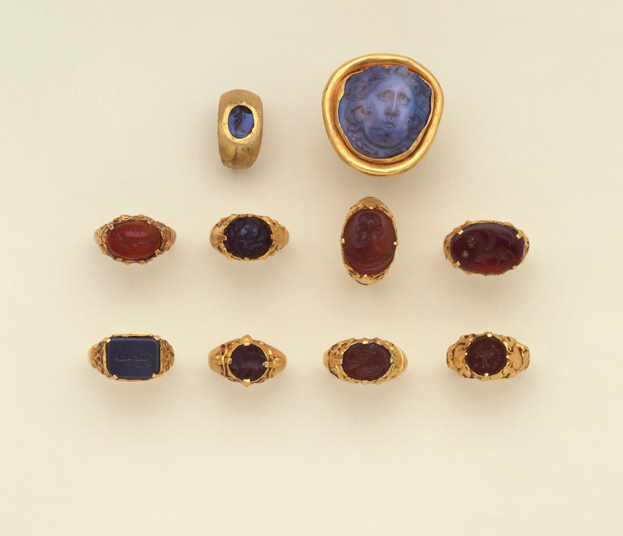 A Roman Gold and Chalcedony Intaglio Ring, a Large Roman Blue-Grey Chalcedony Medusa Head Cameo and a Selection of Rings, Two Rings in the Seljuk Style by Roman Roman