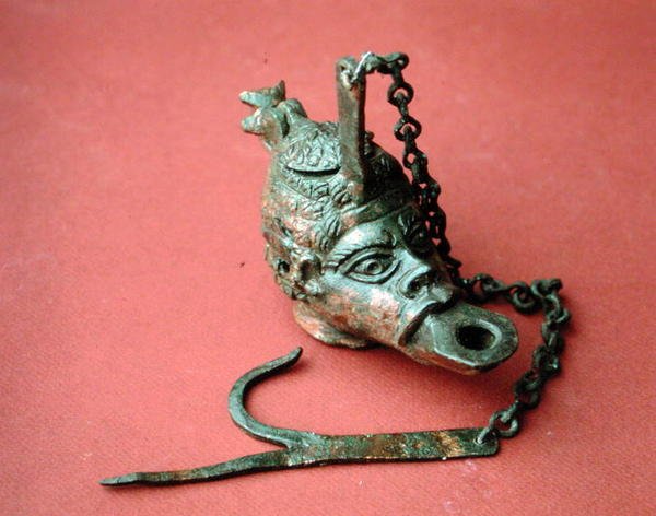 Hanging oil lamp in the shape of an African