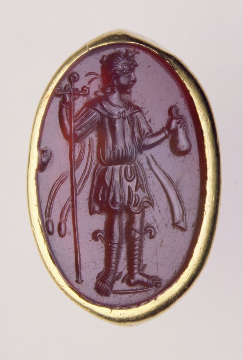 Intaglio set in a gold ring depicting young male figure by Roman Roman
