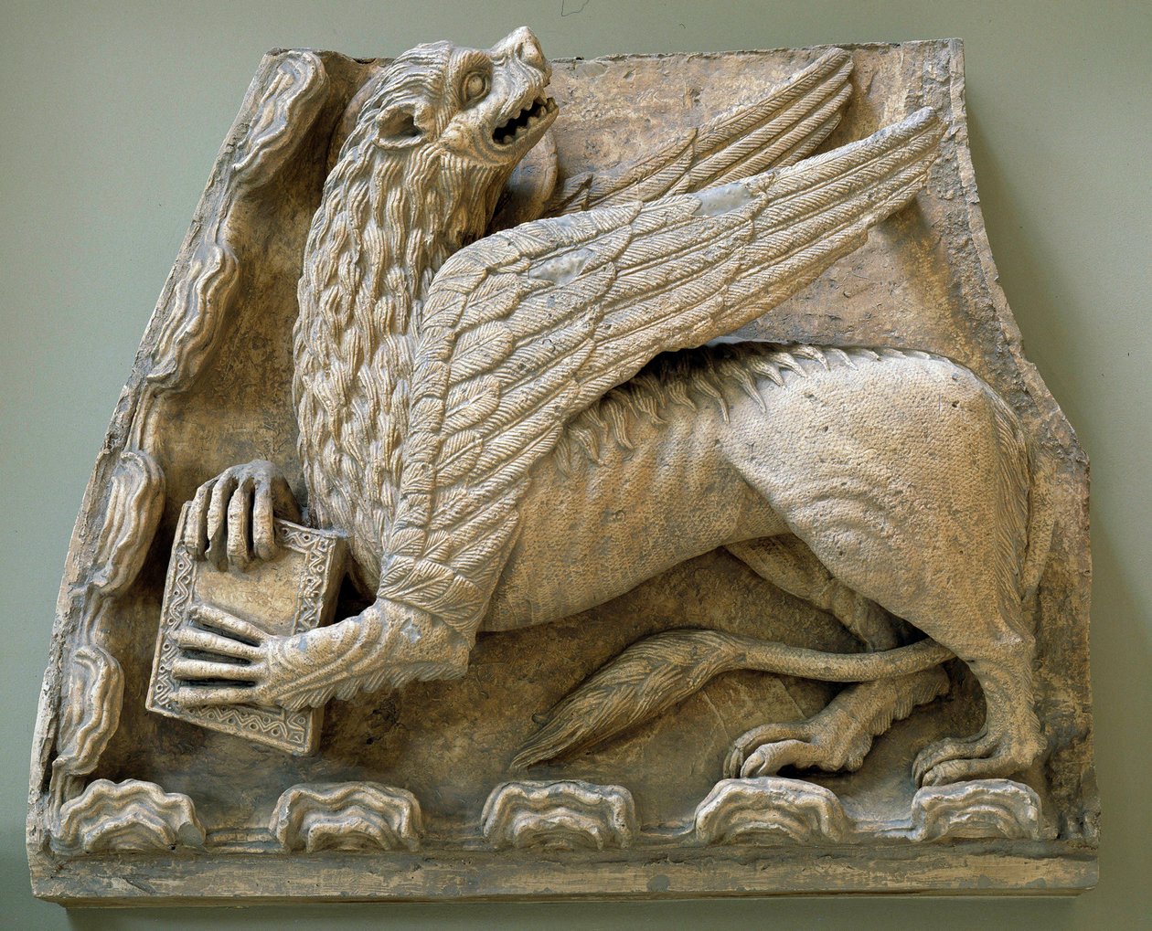 Griffon sculpts from the original of the portal of the Church Saint Loup de Naud by Romanesque