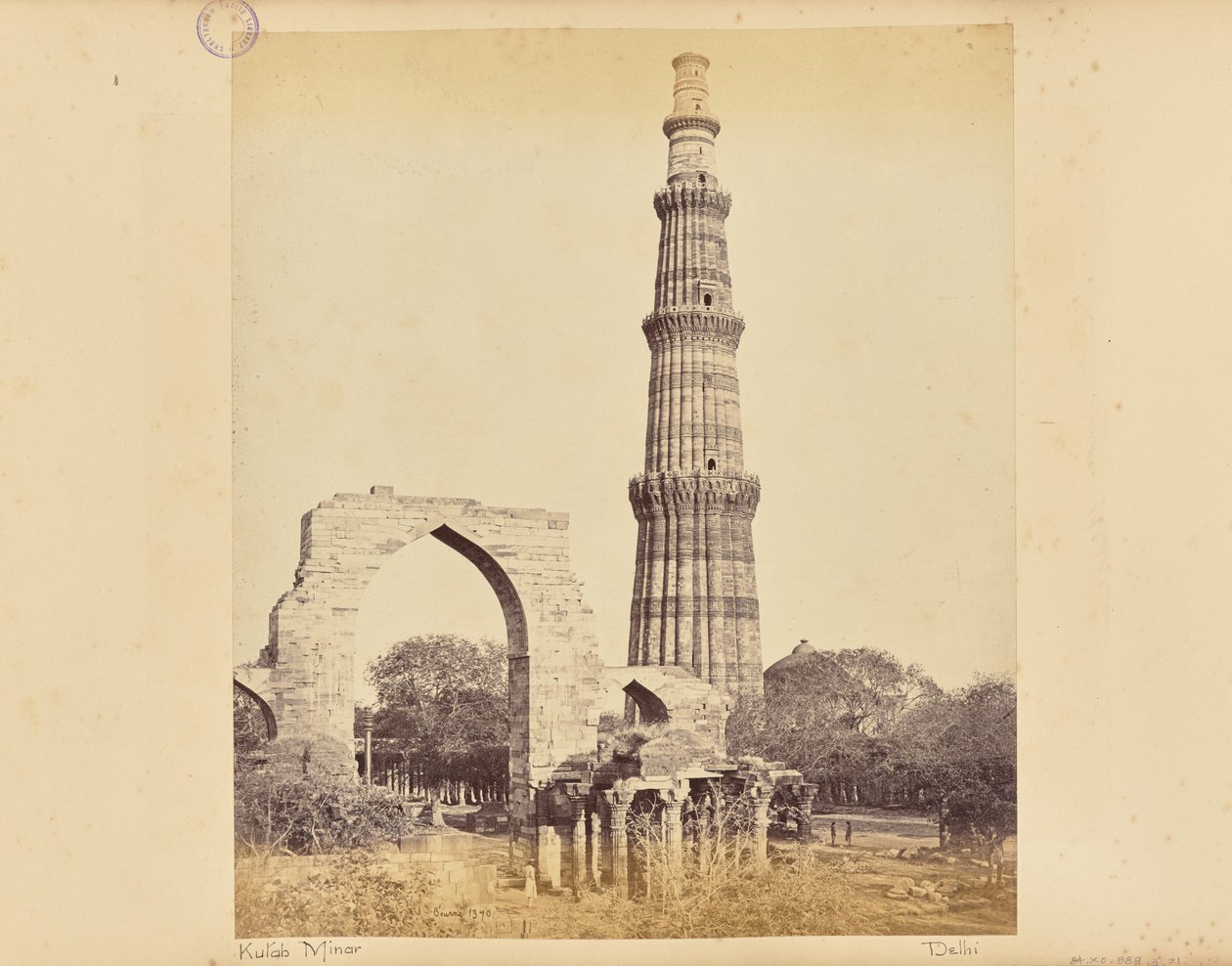Delhi; The Kutub Minar, with the Great Arch, from the West by Samuel Bourne