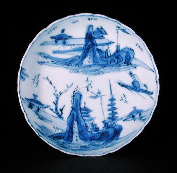 Blue and white saucer dish painted with a fisherman in a boat, Wanli or Tianqi by School Chinese