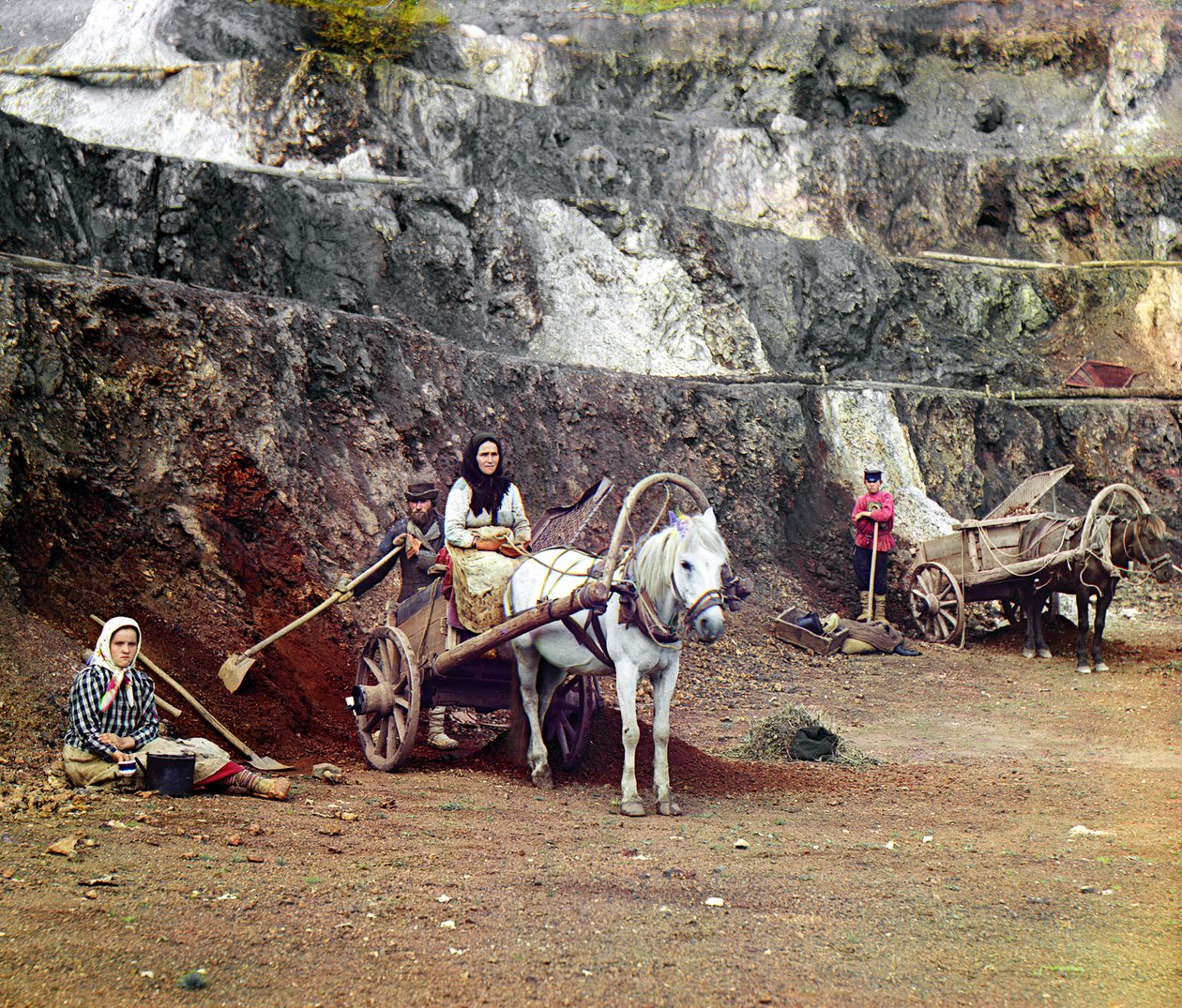 Work at the Bakalskii mine: a family, with shovels and horse-drawn carts, working at the iron mines in the Bakaly hills, Ural Mountains, Russian Empire, 1910 by Sergey Prokudin Gorsky