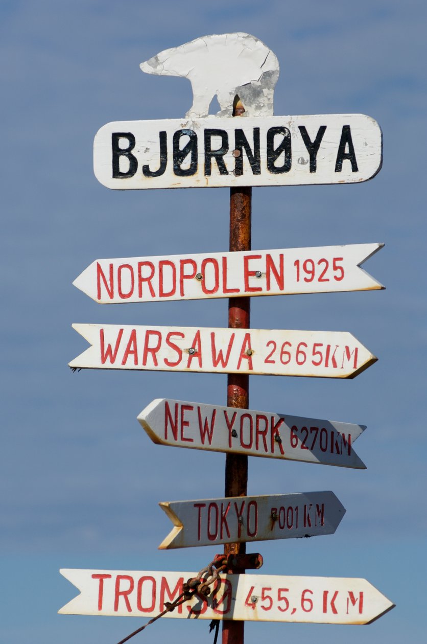 Directional sign on Bear Island, Norway by Sisse Brimberg