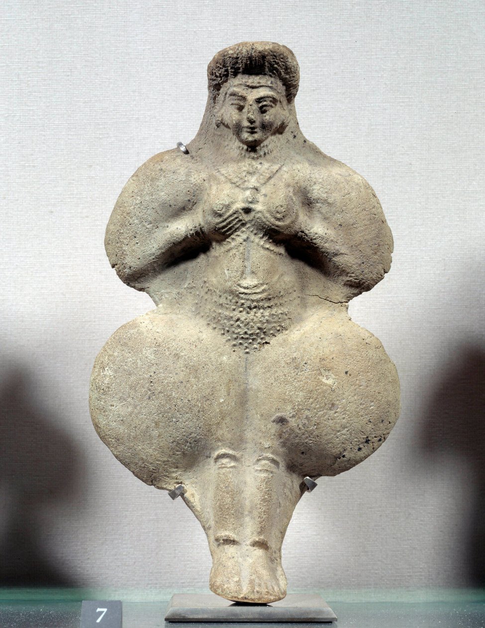 Terracotta statuette of woman holding her breasts, probable representation of Ishtar, goddess of fertility. From Susa. Iran. Elamite period. 14th-12th century BC. Louvre Museum by Sumerian Sumerian