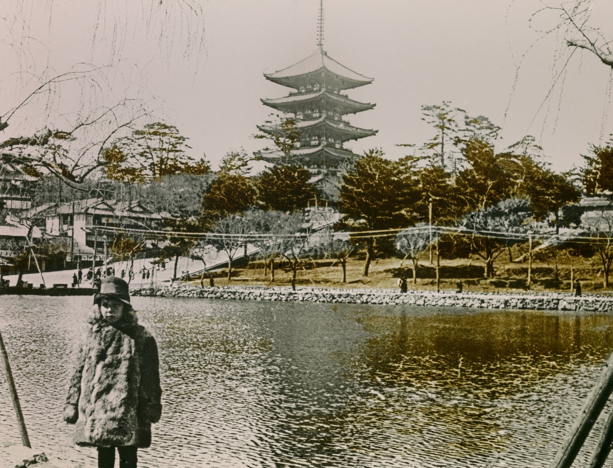 Portrait of a Young Japanese Man in Front of a Pagoda in Tokyo, circa 1900 - 1915 by Teijiro Takagi