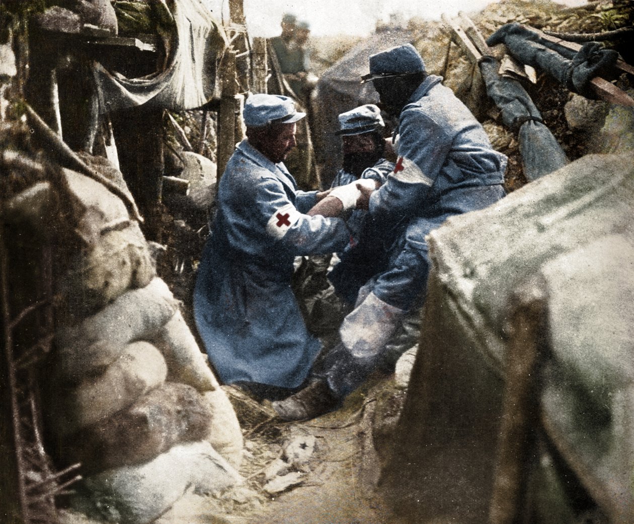 First Aid to a Wounded Man in One of the French Trenches, 1915 by Unbekannt