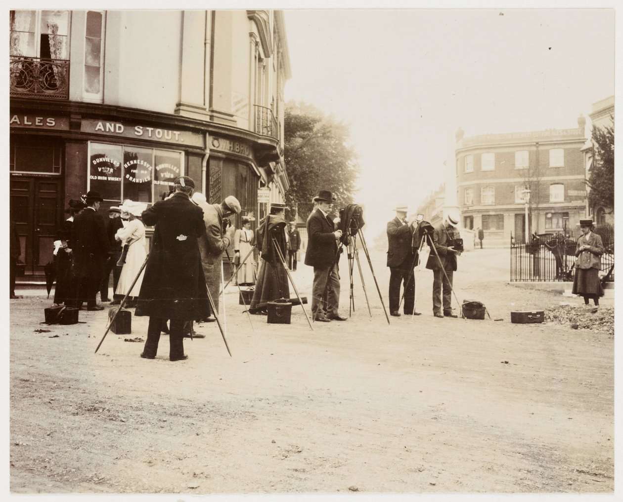 Group of photographers taking photographs in the street by Unbekannt
