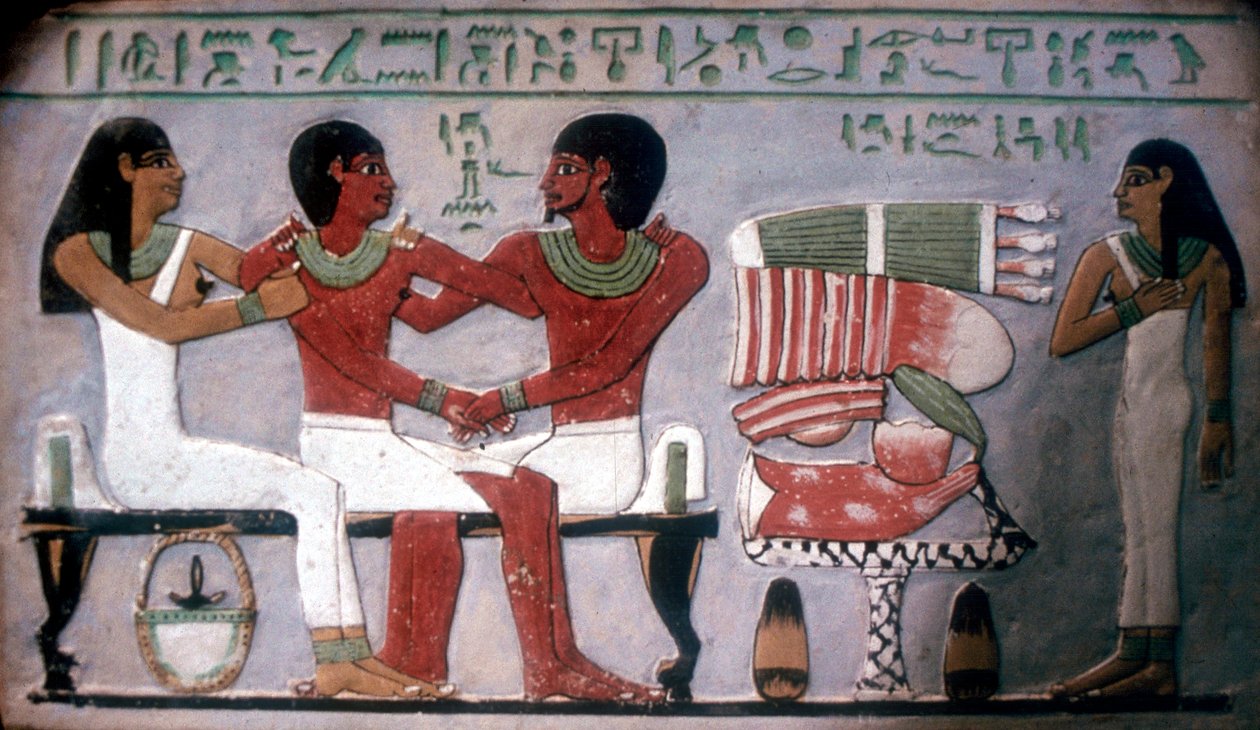 Relief of Imn-Hat seated with his wife & son in front of an offering by Unbekannt
