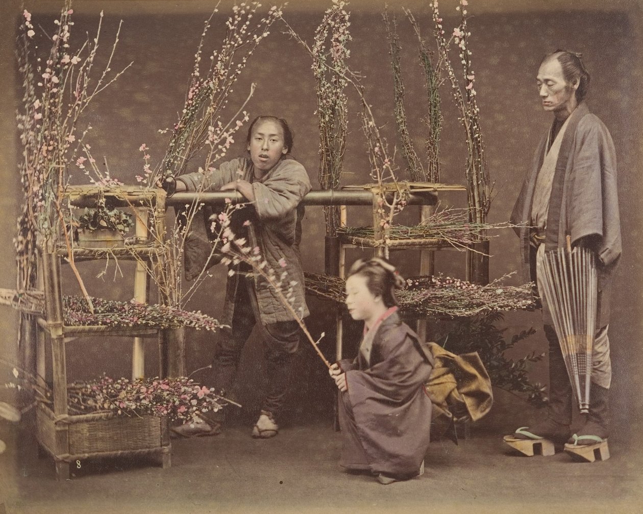 Two Japanese Men and One Japanese Woman Posing with Flowering Branches, 1870s by Unbekannt