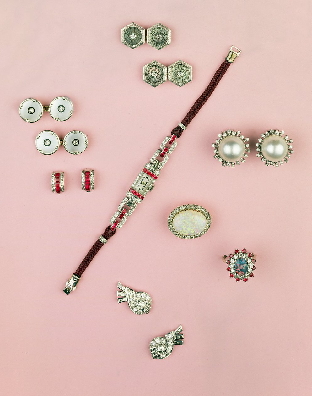 Selection of Art Deco jewellery; calibre cut ruby watch; button, cufflink and studs; earrings; Mabe pearl and diamond earrings by Unbekannt Unbekannt