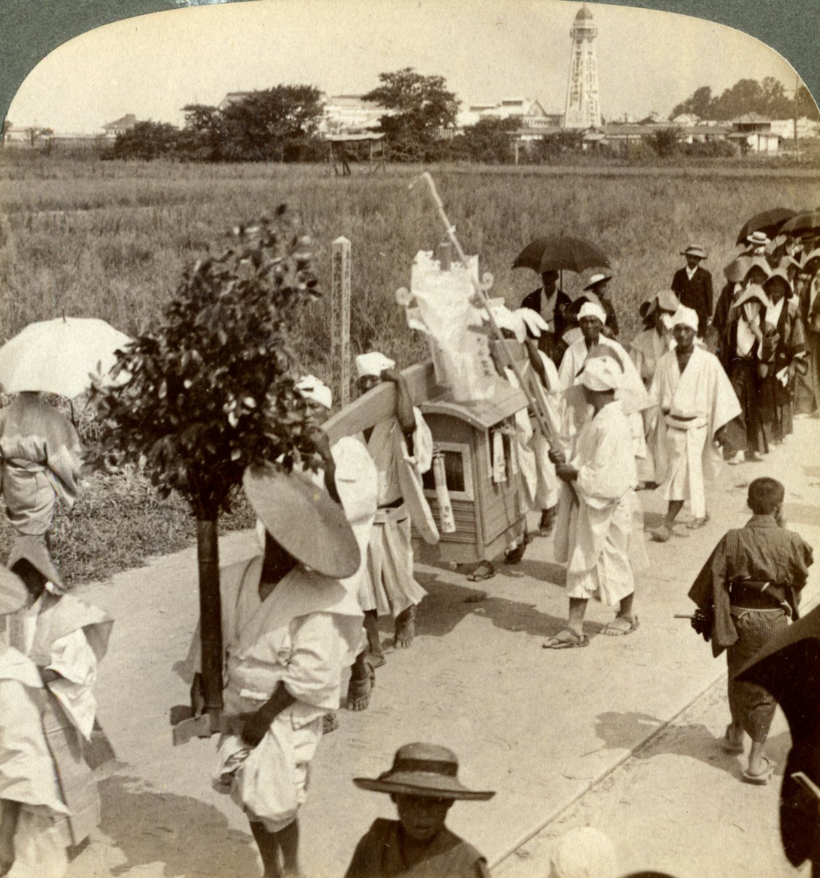 Funeral procession of a rich Buddhist, on the road to Sakai, looking towards Osaka, Japan by Underwood and Underwood