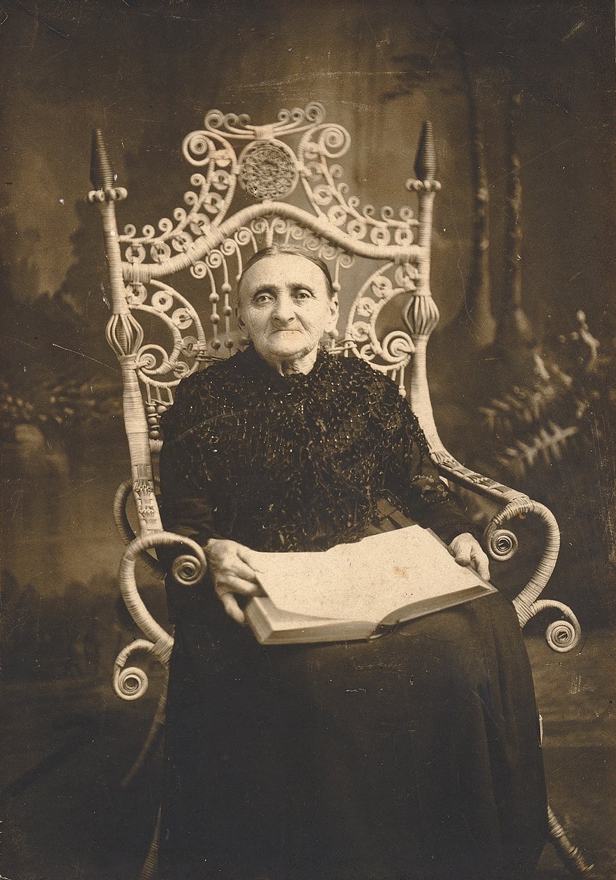 Untitled (Portrait of Aged Woman in Wicker Chair) by Unidentified