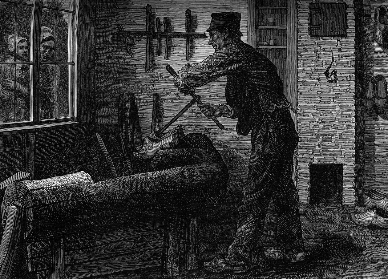 A sabotier at work in his workshop in Belgium by Unknown artist
