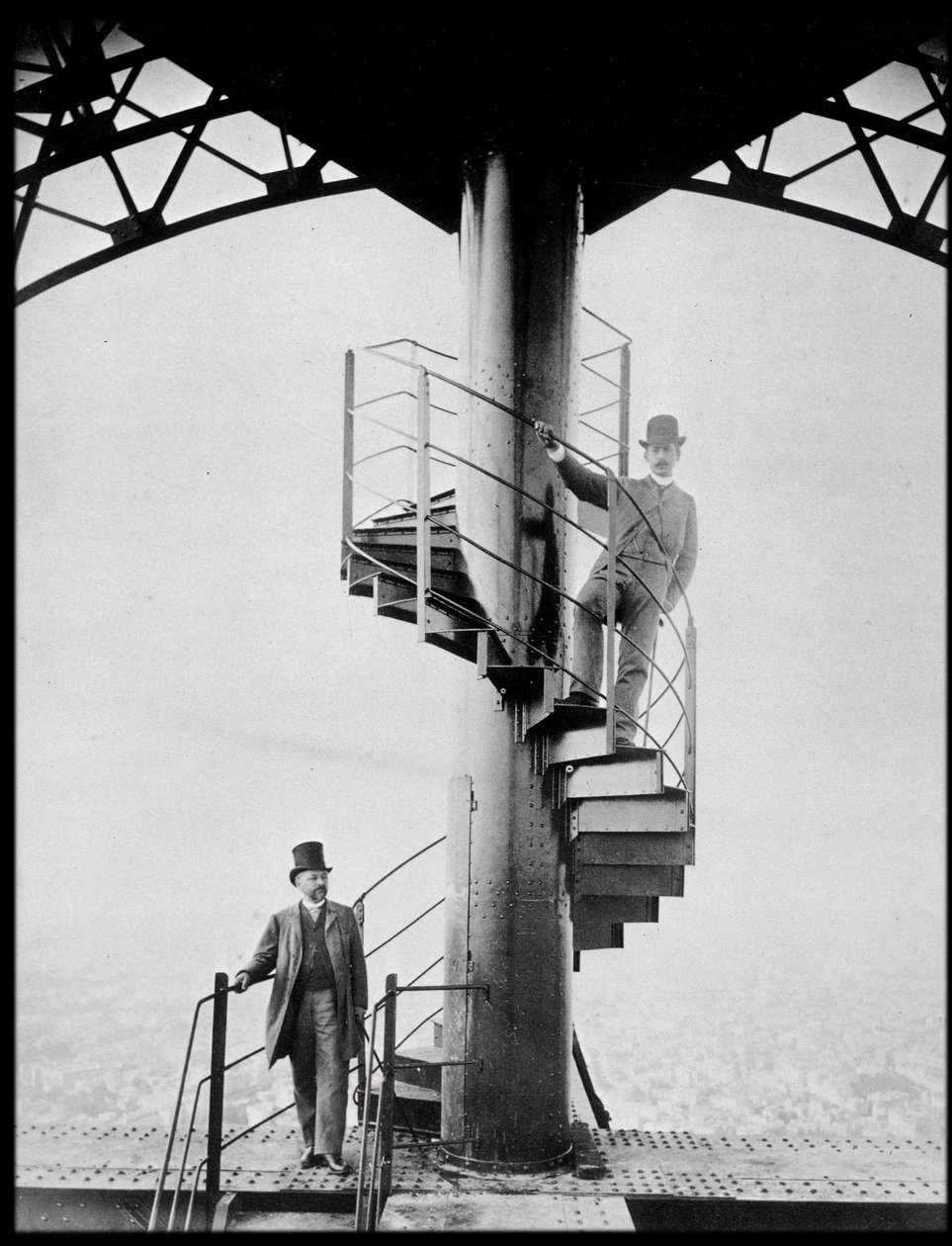 Gustave Eiffel and his son-in-law Adolphe Salles on the staircase of the Eiffel Tower, Paris by Unknown photographer
