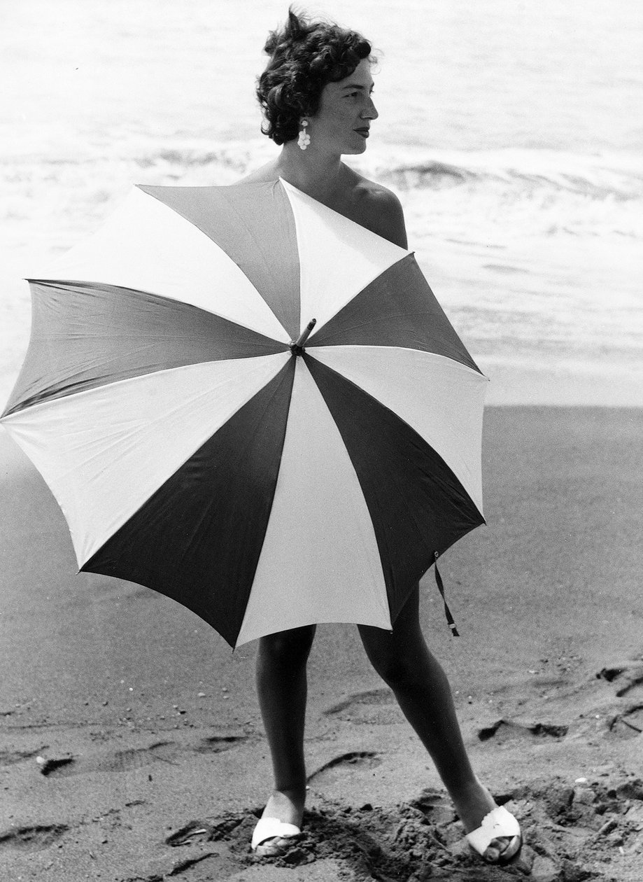 Woman with Umbrella on Beach, c.1960 by Vincenzo Balocchi
