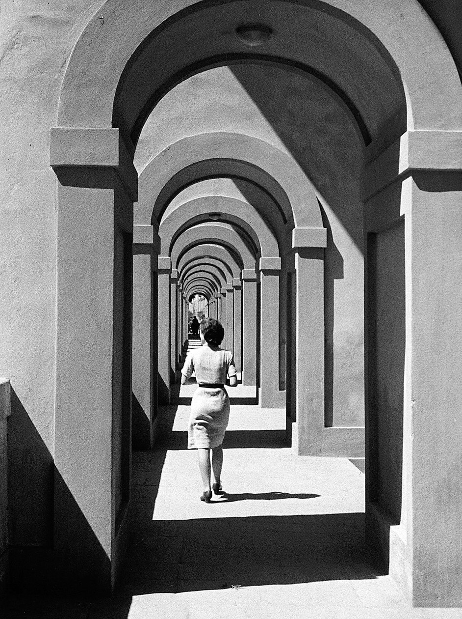 Young Woman Passing Under a Portico by Vincenzo Balocchi