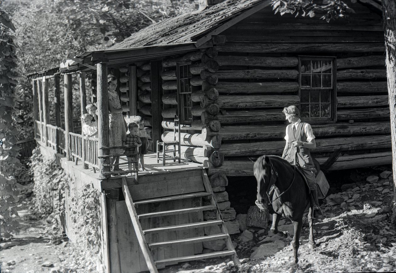 Woman, possible healthcare worker, on horseback visits with neighbors or family by Volkmar Wentzel