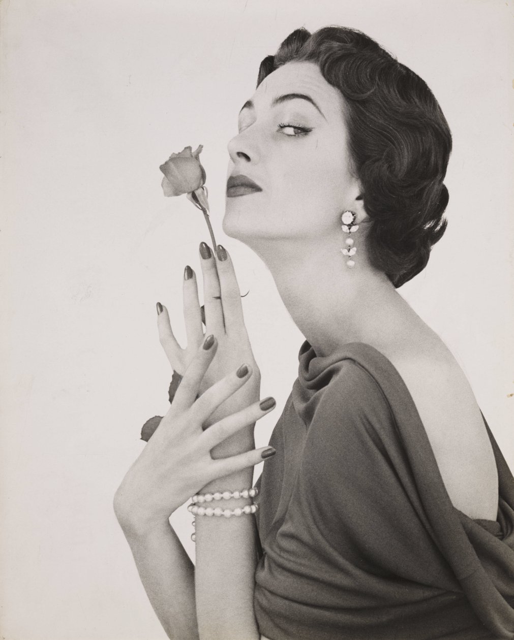 Woman with a rose, c.1960 by Zoltan Glass