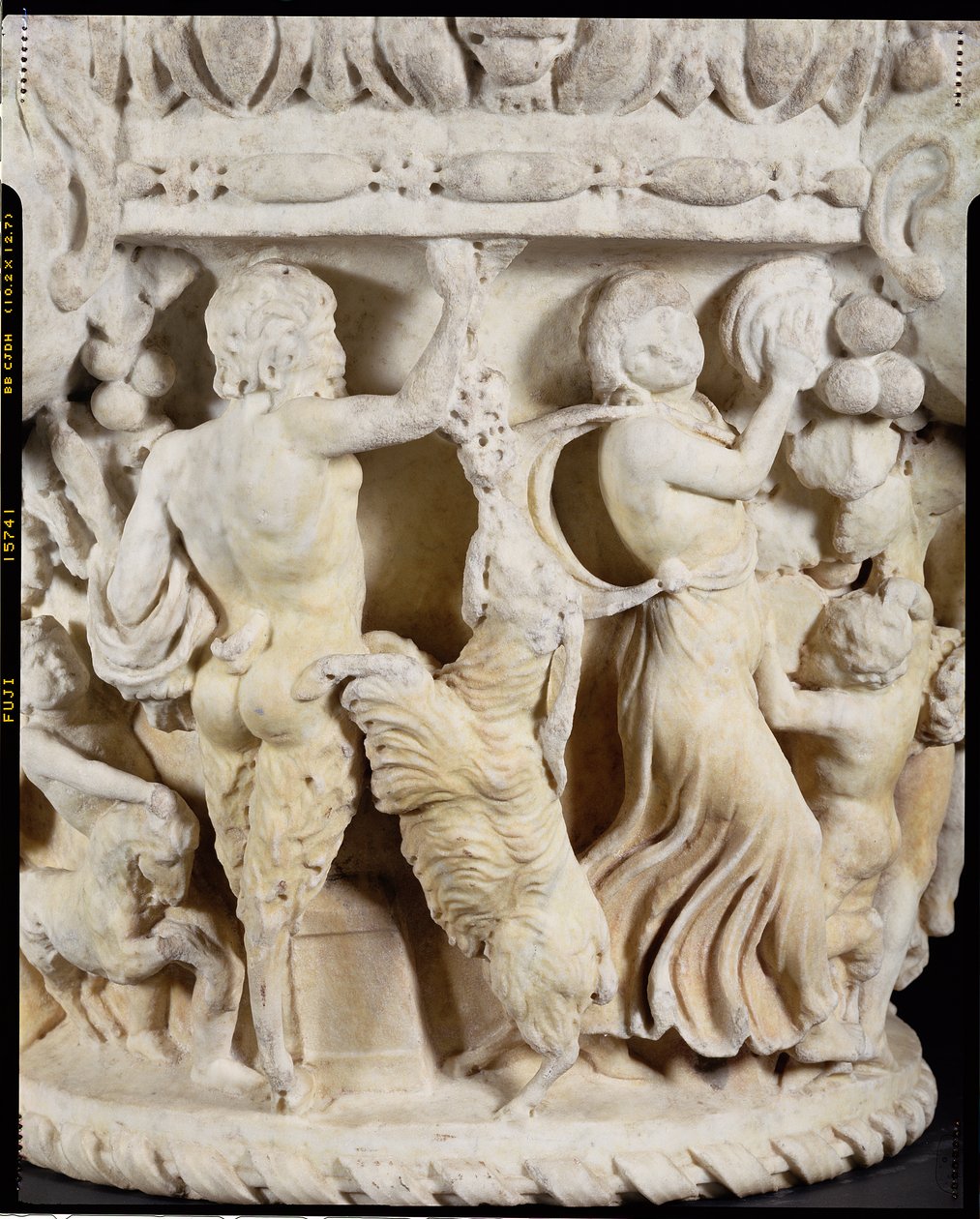 Carved column capital depicting Pan teasing a rearing goat with a bunch of grapes and a maenad beating time with a tambourine, Italian, from Rome, c.180-220 (detail) by Hippolyte Lalaise Devéria