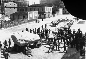 Carrara: numerous oxen pull a wagon loaded with an enormous block of marble coming from the Apuan quarries by A. Corsini
