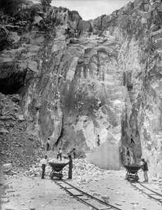 Excavators at work at a marble quarry in the Apuan Alps, in Tuscany (b/w photo)