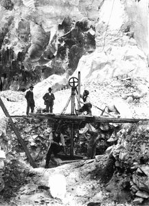 Some excavators at work in a marble quarry in the Apuan Alps, in Tuscany