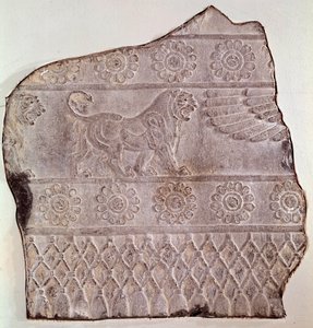 Fragment of low relief representing a walking lion, from Persepolis by Achaemenid