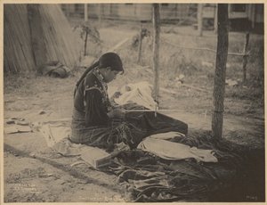 Woman of the Meskwaki Nation Engaging in Beadwork