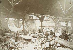Men in a workshop hammering sheets of copper for the construction of the Statue of Liberty by Albert Fernique