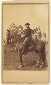 Man Wearing a Hat, in Profile, on Horseback