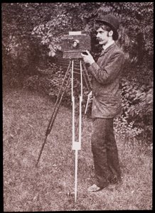 Self portrait with camera, tripod and pistol by Alfred Stieglitz