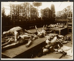 Six Male Models as Ancient Warriors Dressed in Armor Pretending to be Dead