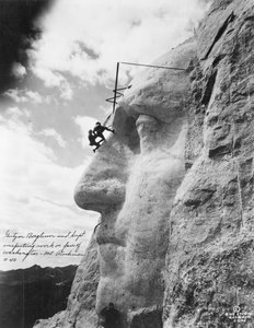 Gutzon Borglum inspecting work on Washington at Mount Rushmore, 1932