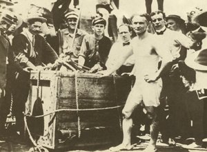 Harry Houdini being lowered into the ice-covered Detroit River in 1907 by American Photographer