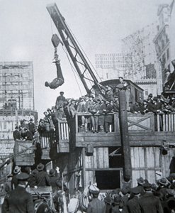 Houdini Escaping from a Strait-Jacket While Suspended from a Crane in New York City by American Photographer