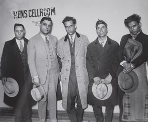 Joe Aiello (1891-1930) with his henchmen in police custody by American Photographer