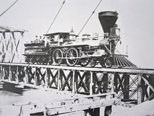 Locomotive of the US Military Railroads (Union Army) crossing trestle bridge over the Potomac River