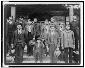 Native American Men and a Boy Posed Outside of Carlisle Indian School, Pennsylvania, c.1890