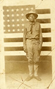 World War I soldier with American flag in background