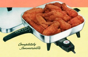 Chicken Frying in a Retro Electric Pan by American School