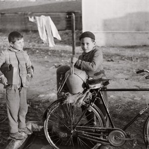 Child Water Carrier on Bicycle