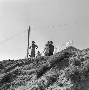 Women and Children Spreading Laundry